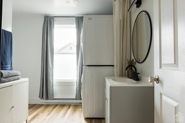 bathroom with wood finished floors and vanity