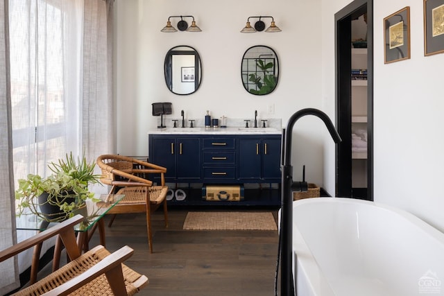 bar with dark wood-style flooring and a sink