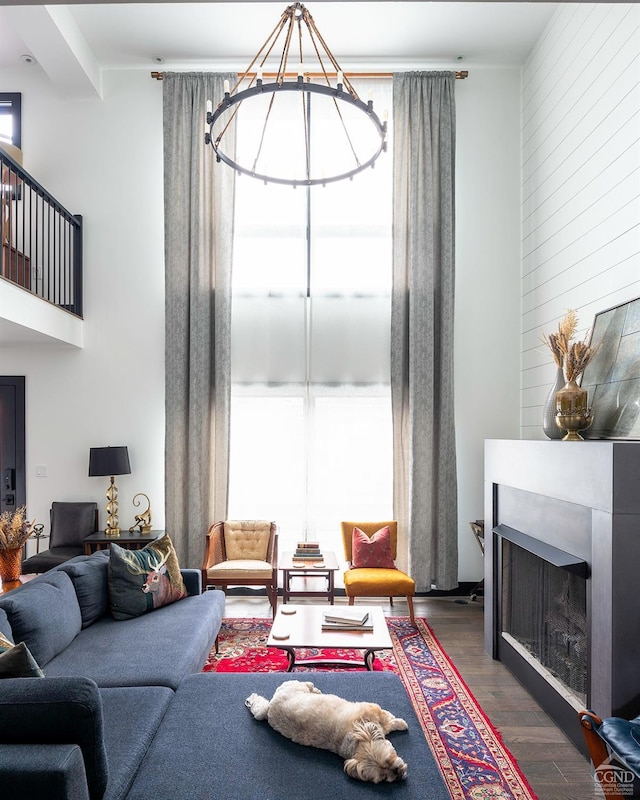 living room with a fireplace and wood finished floors