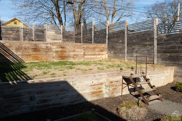 view of yard featuring a fenced backyard