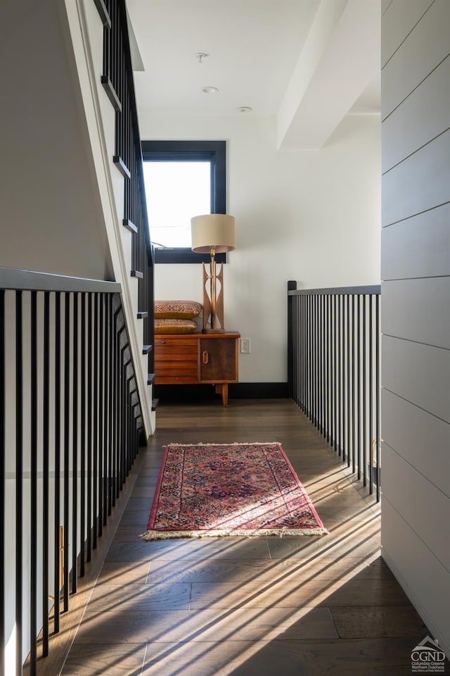stairway with baseboards and wood-type flooring