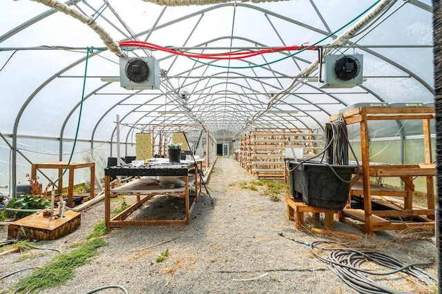 view of patio featuring ac unit and an outdoor structure