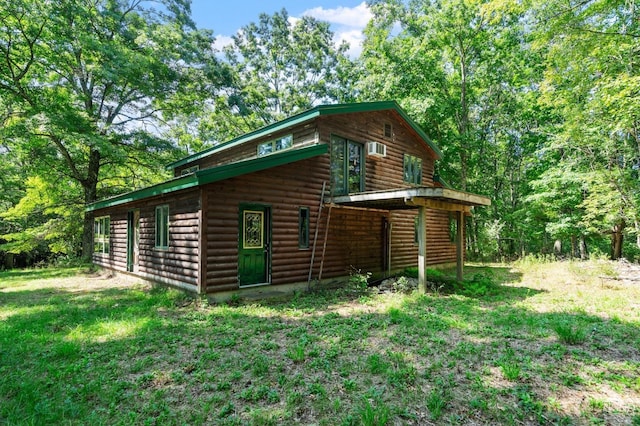 view of home's exterior featuring a lawn