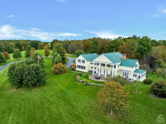 birds eye view of property featuring a wooded view