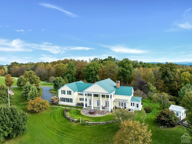 aerial view featuring a wooded view