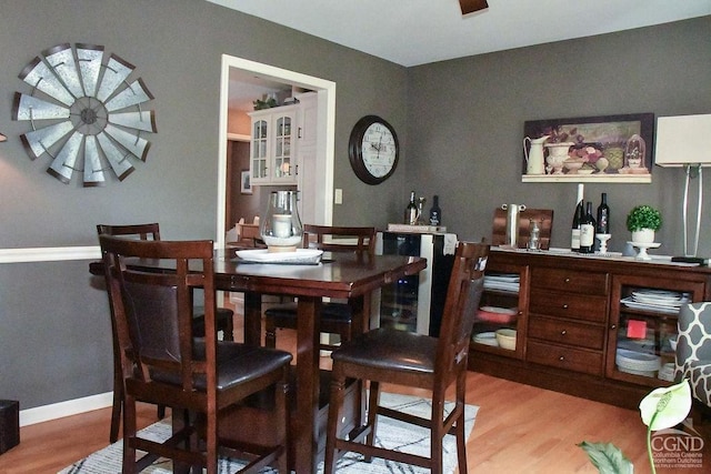 dining area featuring baseboards and wood finished floors