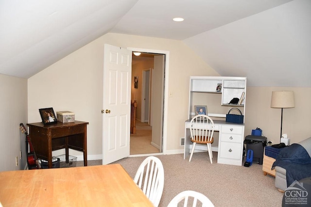 interior space with vaulted ceiling and carpet