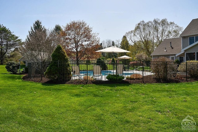 view of yard featuring a fenced in pool and fence