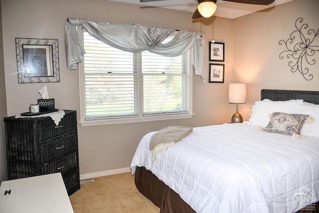 carpeted bedroom featuring baseboards
