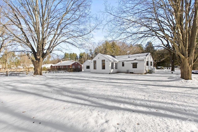 view of front of house featuring fence