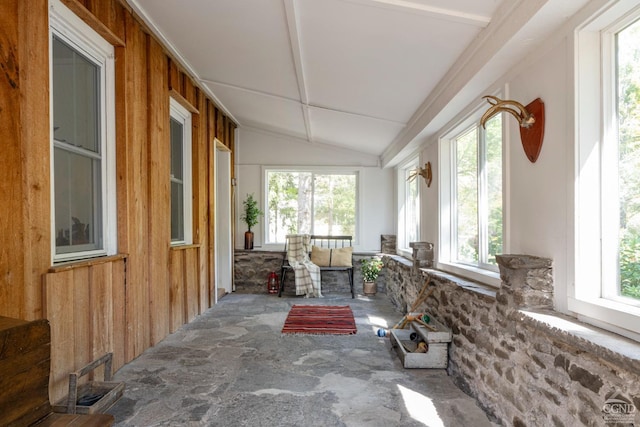 sunroom featuring lofted ceiling and a wealth of natural light