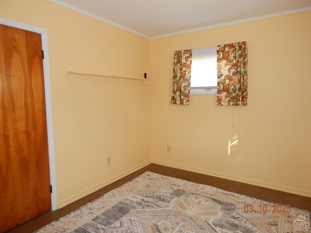 unfurnished room featuring baseboards and ornamental molding