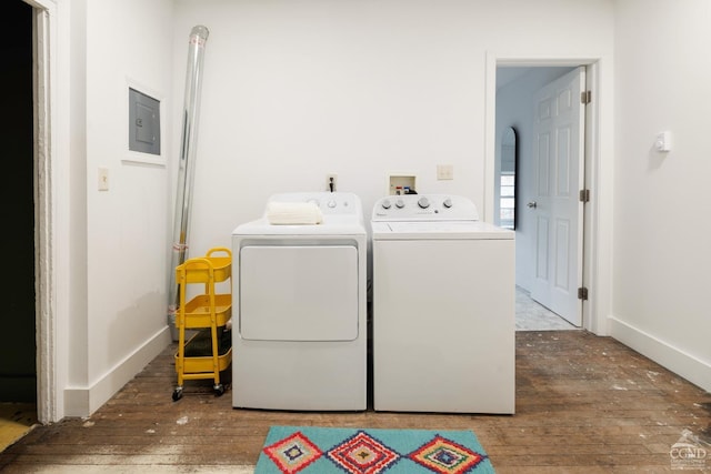 washroom featuring separate washer and dryer, dark hardwood / wood-style floors, and electric panel