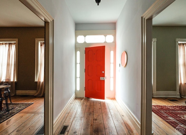 foyer entrance with light hardwood / wood-style flooring