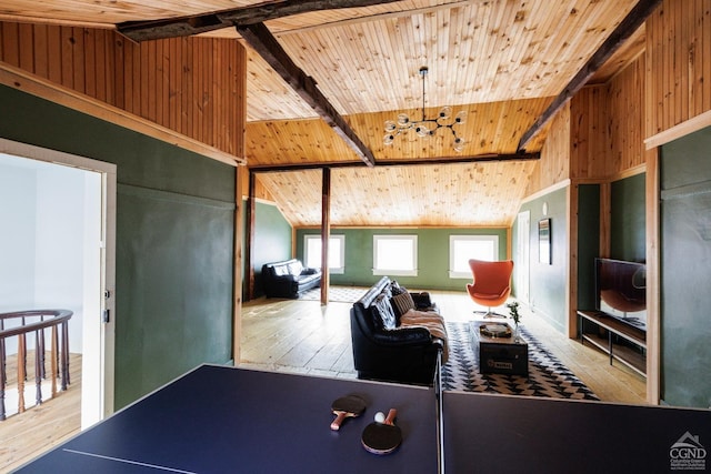 recreation room featuring wood ceiling, wooden walls, light wood-type flooring, and vaulted ceiling with beams