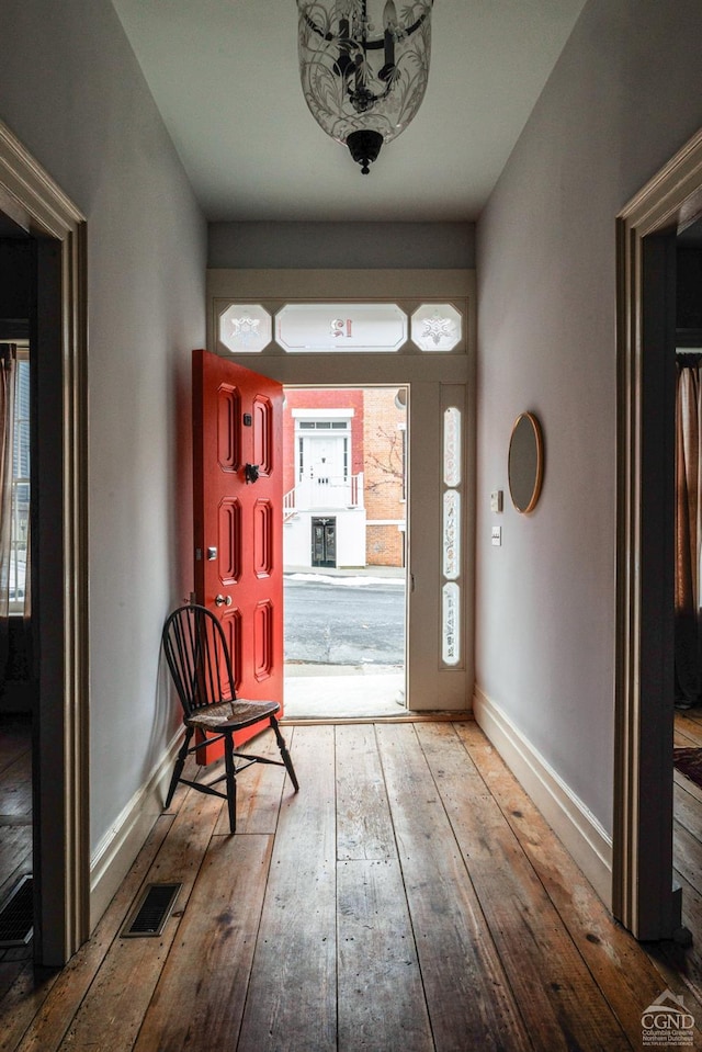 foyer entrance with light wood-type flooring