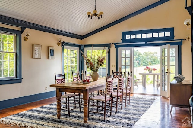 dining space featuring french doors, vaulted ceiling, and a healthy amount of sunlight