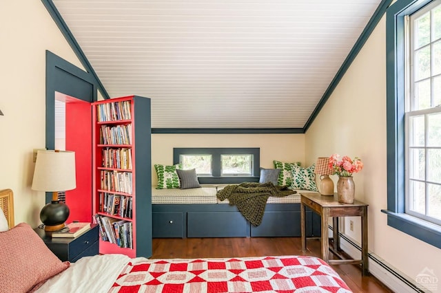 interior space featuring dark hardwood / wood-style floors, baseboard heating, crown molding, and vaulted ceiling