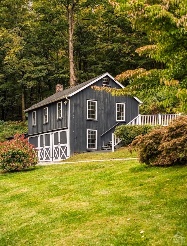 view of outdoor structure with a yard