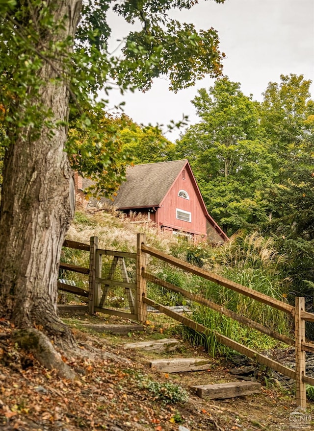 view of gate featuring an outbuilding