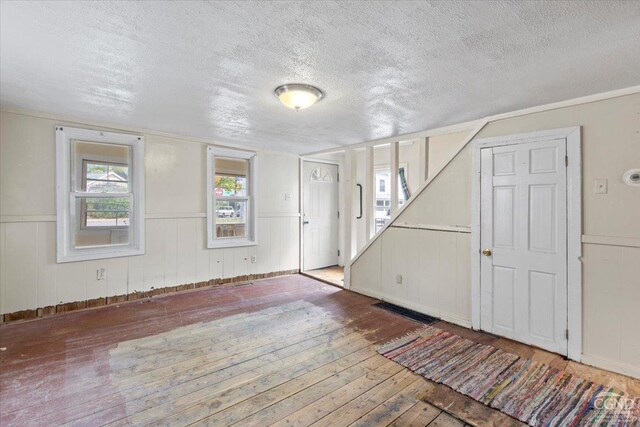 interior space featuring hardwood / wood-style floors and a textured ceiling