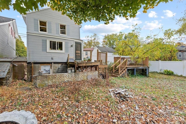 back of property featuring central air condition unit and a wooden deck