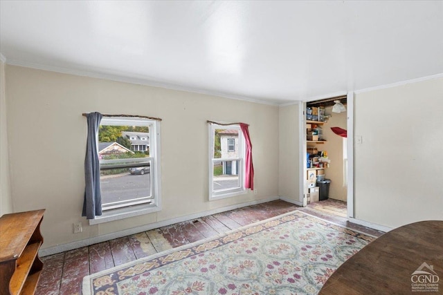 interior space with wood-type flooring and crown molding