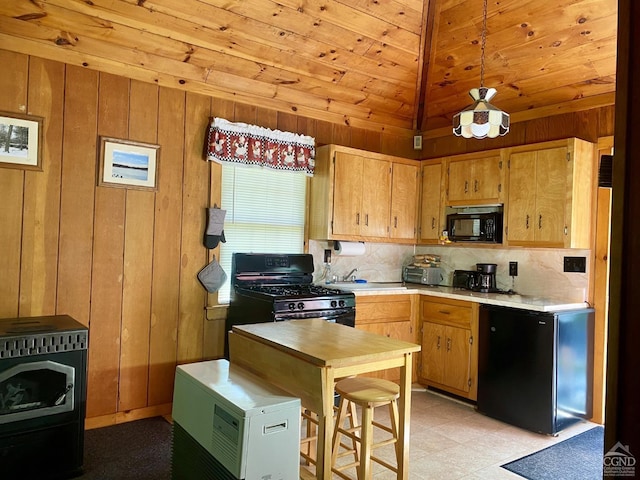 kitchen with wood walls, decorative backsplash, hanging light fixtures, wood ceiling, and black appliances