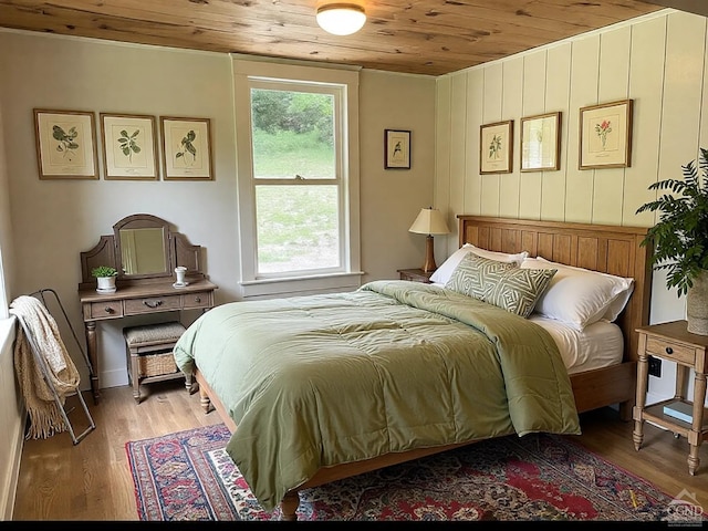 bedroom featuring wood ceiling and light wood-type flooring