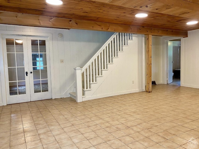 basement with wood ceiling and french doors