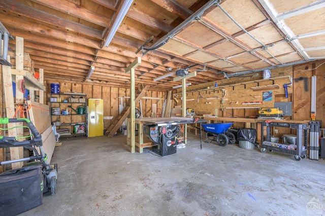 garage featuring a workshop area and a garage door opener