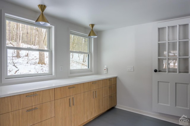 interior space featuring baseboards