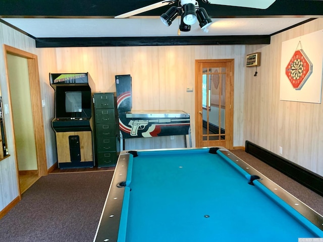 recreation room featuring dark colored carpet, ceiling fan, wooden walls, and billiards