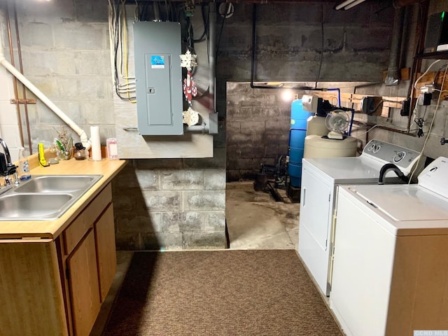 interior space featuring electric panel, cabinets, sink, and washer and dryer