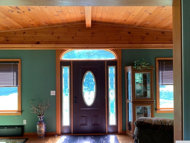 foyer entrance with wood ceiling and a wealth of natural light