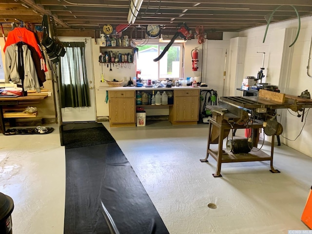 basement with a workshop area