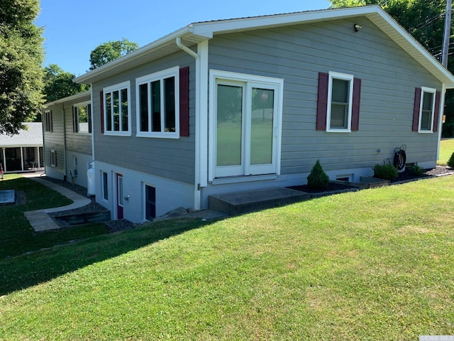 view of home's exterior featuring a yard