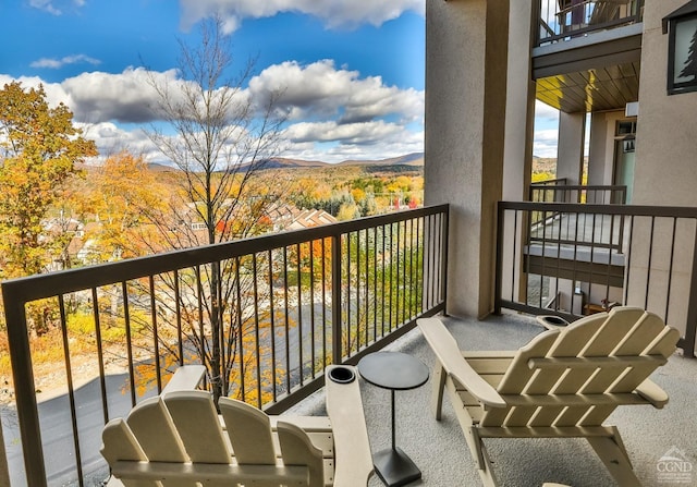 balcony featuring a mountain view