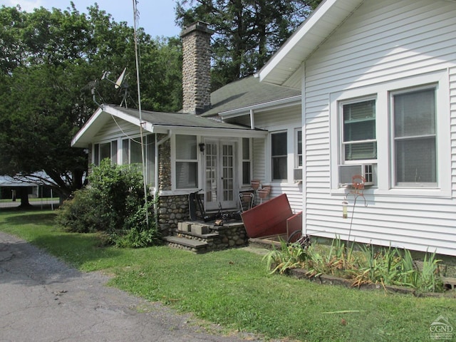 view of front of house featuring a front yard and a sunroom