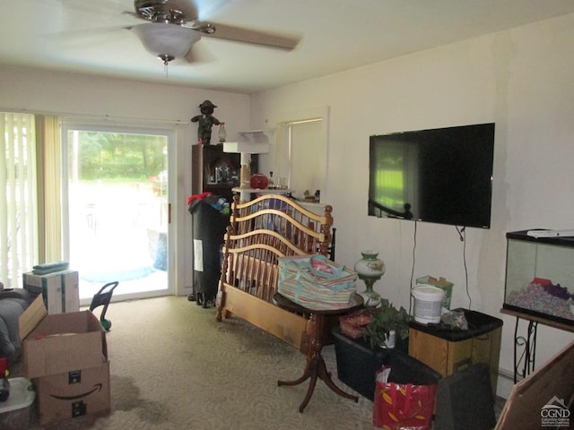 bedroom with carpet floors, access to outside, and ceiling fan