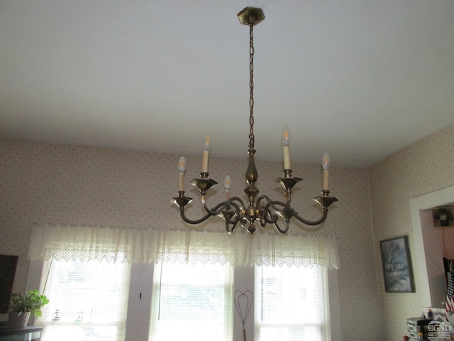 interior details featuring a chandelier