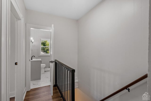 staircase featuring hardwood / wood-style floors