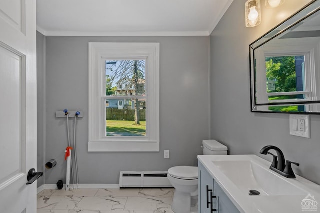 bathroom with vanity, toilet, ornamental molding, and baseboard heating