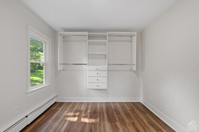 closet featuring baseboard heating