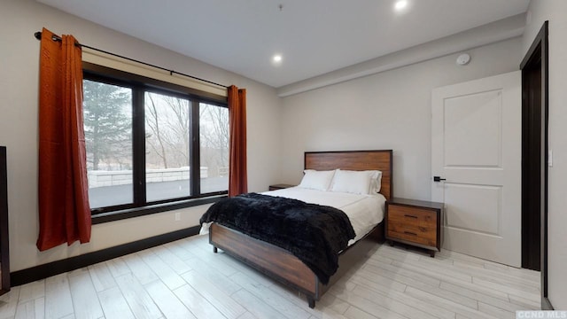 bedroom with recessed lighting and light wood finished floors