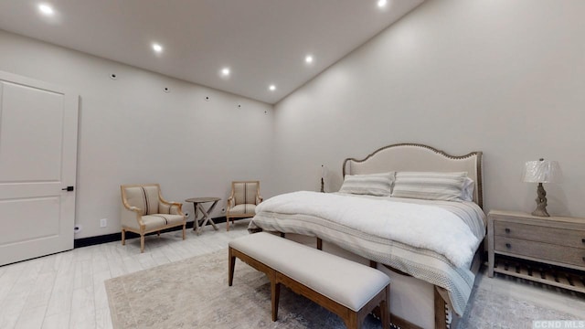 bedroom featuring light wood-style flooring and recessed lighting