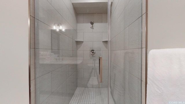 full bathroom with tiled shower