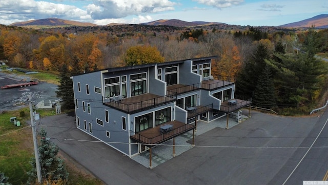 view of front facade with a balcony and a mountain view