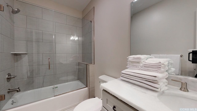 bathroom featuring vanity, toilet, and bath / shower combo with glass door