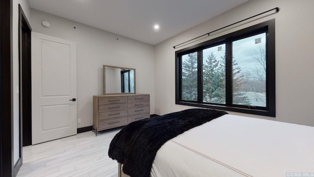 bedroom featuring light wood-style floors and recessed lighting